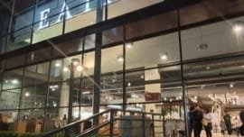 iew of Eataly São Paulo’s main entrance at night with glass façade and illuminated sign