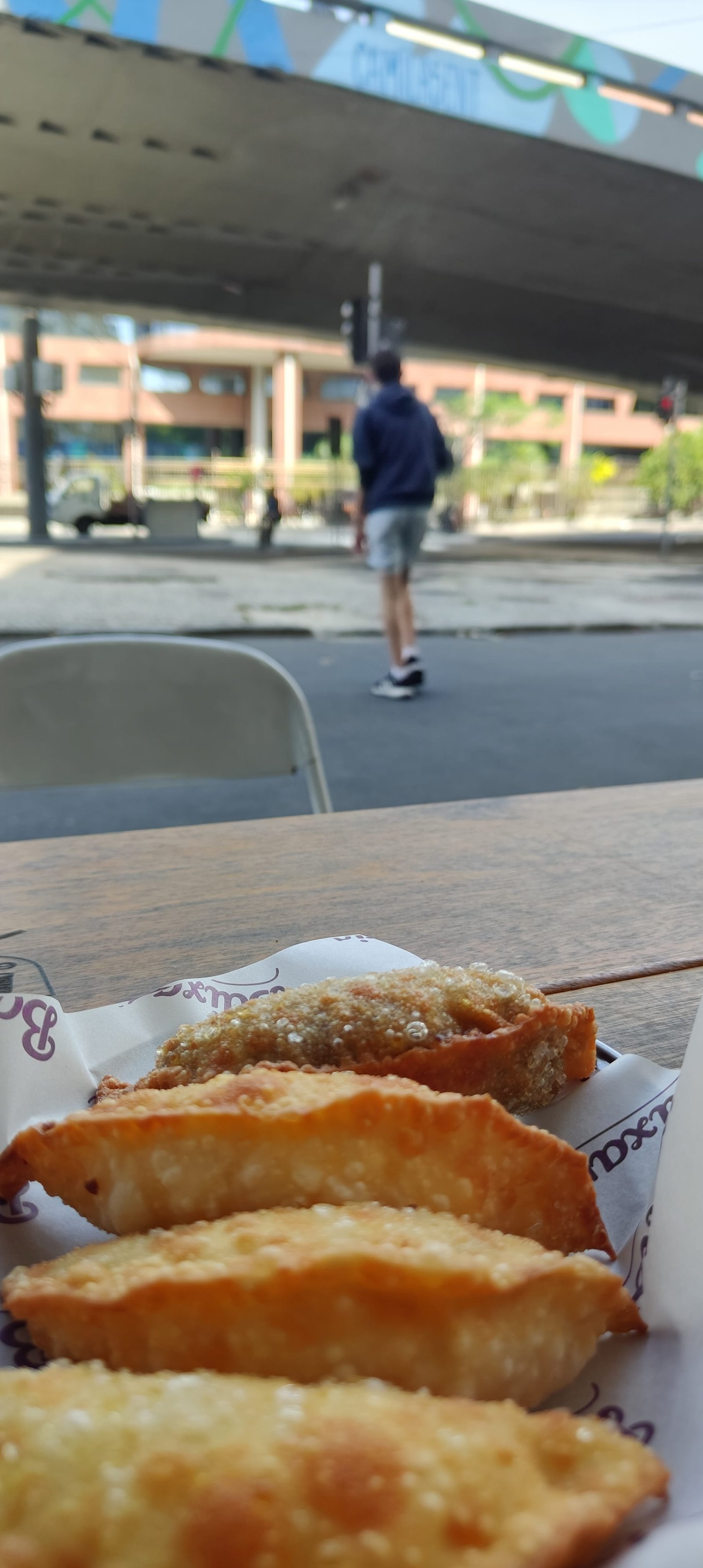 Golden, crispy cheese pastries served at Baixaria Botafogo, capturing the cozy and colorful vibe of the best bars in Botafogo.