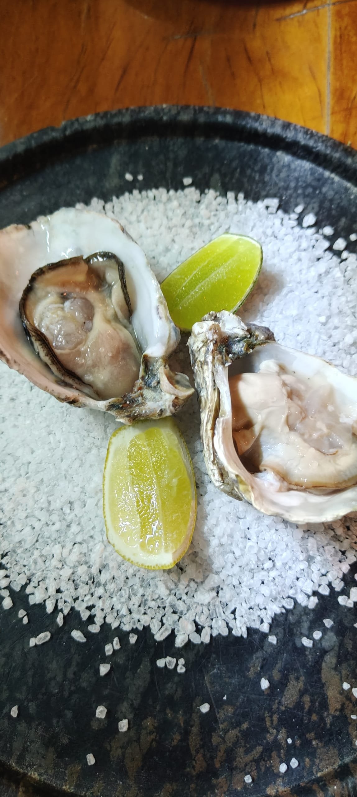 Fresh oysters served over coarse salt with lemons at Da Marino restaurant in Ipanema.